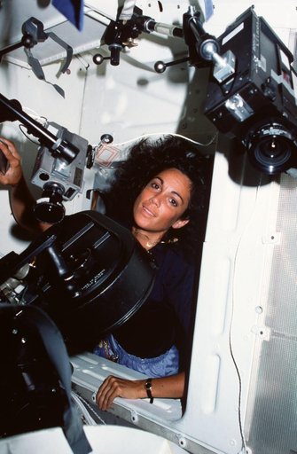 Mission specialist Judith Resnik at interdeck access hatch