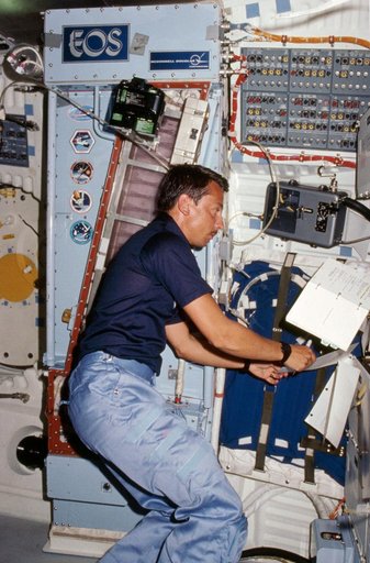 Payload specialist Charles Walker works with CFES experiment