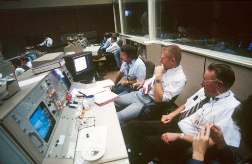 View of activity in the Mission Control Center during STS 41-D