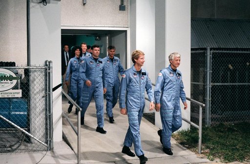 41-D crew leaves operations and checkout building at KSC