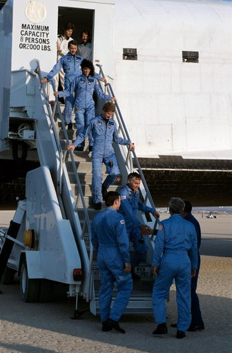 Crew of STS 41-D mission exit orbiter after landing
