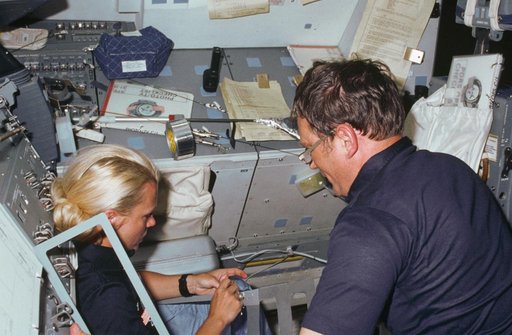 Astronauts Seddon and Bobko work on extension for RMS