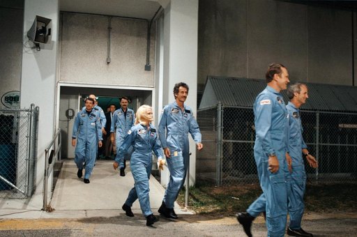 STS 51-D crewmembers depart KSC's operations and checkout building