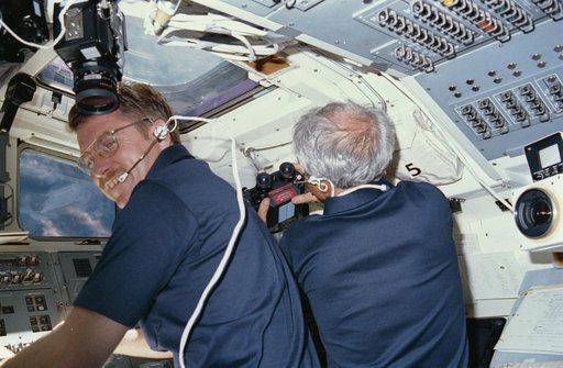Astronauts England and Bartoe working at aft fligh deck station