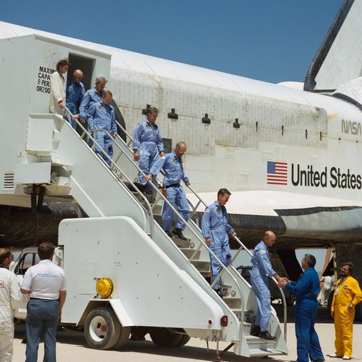 STS 51-F crew egress the orbiter and are greeted by George Abbey
