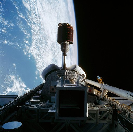 Telstar 3-D communications satellite deploying from Discovery's payload bay