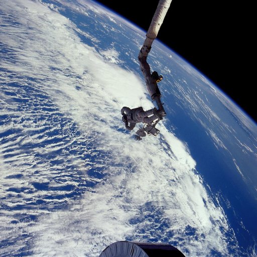 Astronaut James van Hoften on RMS tracking Syncom IV-3 after deployment