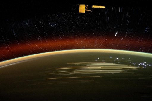 Star trails glitter above Earth's atmosphere