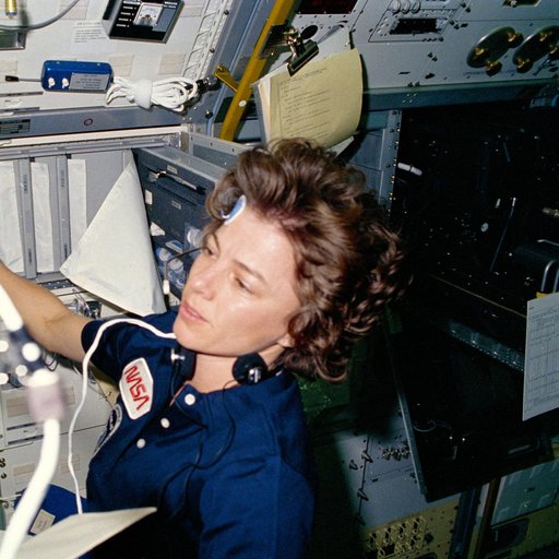 Astronaut Bonnie Dunbar preparing to perform bio-medical test