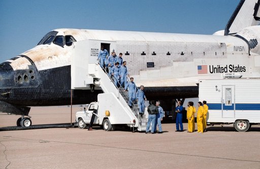 The crew of the STS 61-A mission egress the Orbiter after landing