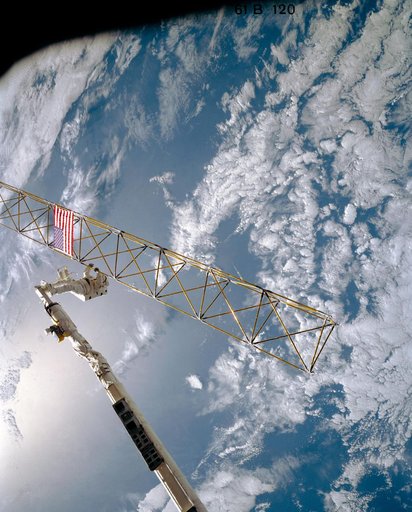 Astronaut Sherwood Spring on RMS checks joints on the ACCESS device