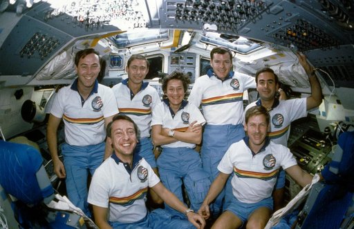 STS 61-B crew portrait in-flight on the aft flight deck