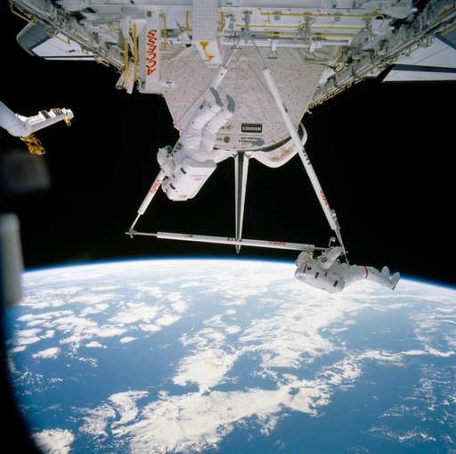 Astronauts Jerry Ross and Sherwood Spring assemble ACCESS components