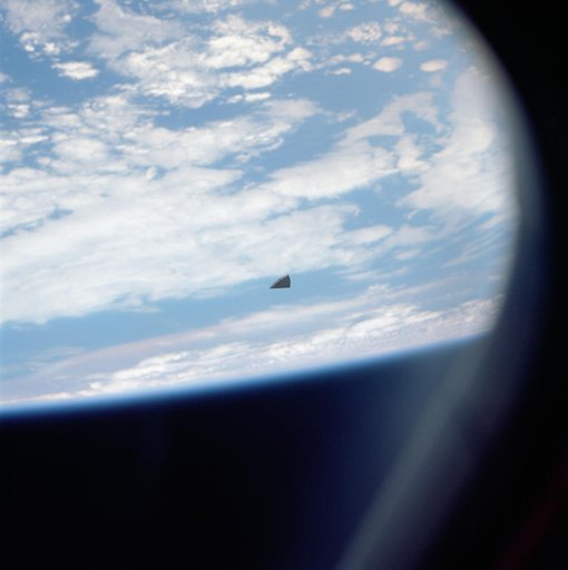 Piece of thermal insulation tile floats near the Shuttle Columbia