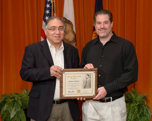 Dr. Jacob Cohen presents the H. Julian Allen award to Anthony Colaprete.