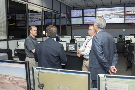 Bridenstine stands by AFRC center director David McBride in one of Armstrong's mission control rooms that monitor flights, talk with pilots and gather data to project analysis.