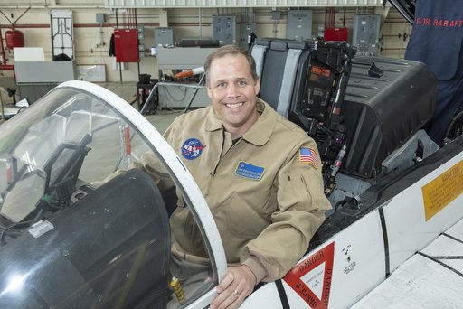 NASA Administrator Bridenstine sits in F-18 jet cockpit in NASA Armstrong Flight Research Center hangar in California where he did a Facebook Live event.