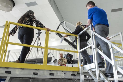 NASA Administrator Bridenstine sits in F-18 jet cockpit in NASA Armstrong Flight Research Center hangar in California where he did a Facebook Live event.