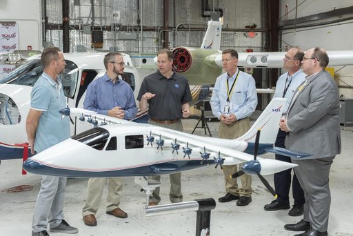 Armstrong X-57 team brief NASA Administrator Bridenstine about the progress of making a combustion aircraft into an all-electric airplane. X-57 is in Scaled Composites hangar at Mojave Air & Space Port in California. Model of the final aircraft design sta