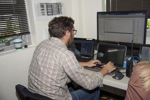 QSF18 Field Research Team Monitors Data from Flight