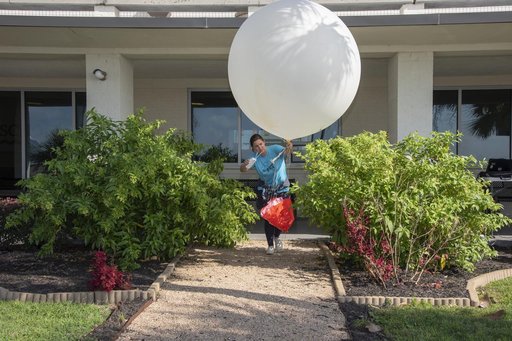 NASA Meteorologists Launch Weather Balloon Before Research Flight