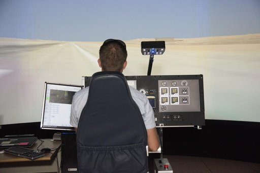 Astronaut Pilots X-57 Simulator at Armstrong Flight Research Center