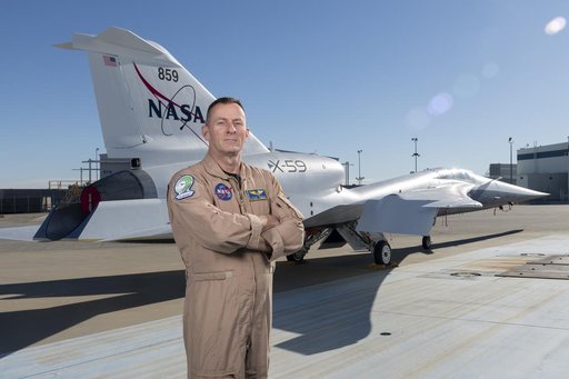 NASA Test Pilot Jim Less Poses with X-59 Research Aircraft