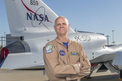 NASA Test Pilot Nils Larson Poses with X-59 Research Aircraft