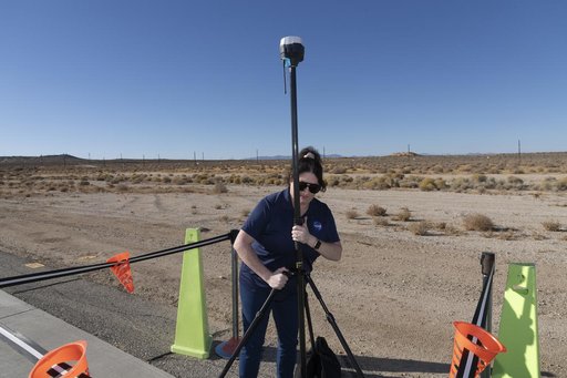 NASA Pathways Intern Adjusts Equipment for Air Taxi Tests