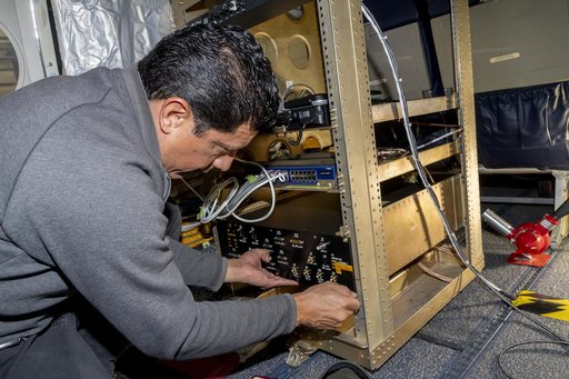 Jose “Manny” Rodriguez adjusts Soxnav instrument onboard the G-IV