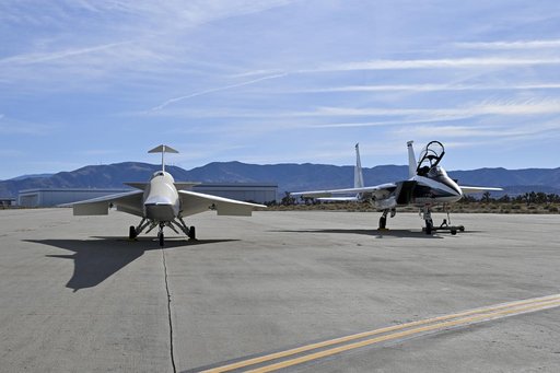 NASA’s F-15D research aircraft is positioned adjacent to the X-59 during electromagnetic compatibility testing at U.S. Air Force Plant 42 in Palmdale, California. Researchers activated the F-15D’s radar, C-band transponder, and radios at different dist