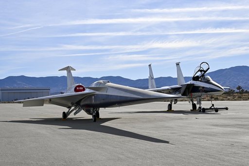 NASA’s F-15D research aircraft is positioned adjacent to the X-59 during electromagnetic compatibility testing at U.S. Air Force Plant 42 in Palmdale, California. Researchers activated the F-15D’s radar, C-band transponder, and radios at different dist