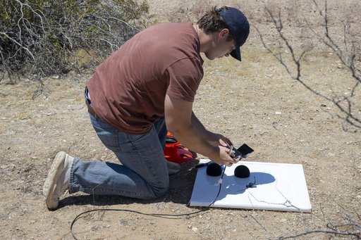 NASA Intern Sets Up Ground Recording System Units