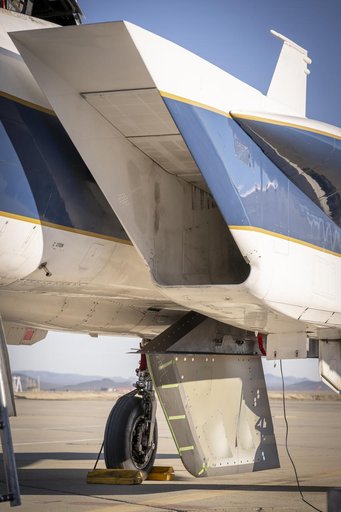 NASA Wing Model Mounted Under F-15 for High-Speed Taxi Test