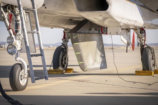 NASA Wing Model Mounted Under F-15 for High-Speed Taxi Test