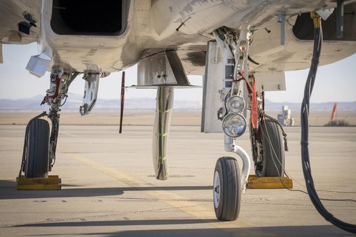 NASA Wing Model Mounted Under F-15 for High-Speed Taxi Test