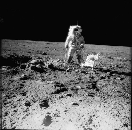 Apollo 12 crewman with tools and carrier of Apollo Lunar Hand Tools
