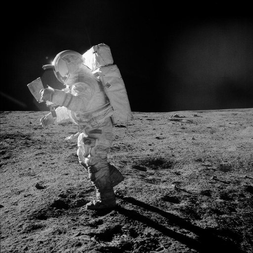 Astronaut Edgar Mitchell looks at traverse map during EVA