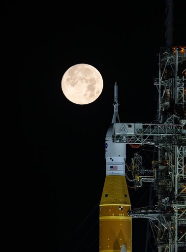Full Moon Rising Over Full Artemis II Stack at Launch Pad 39B