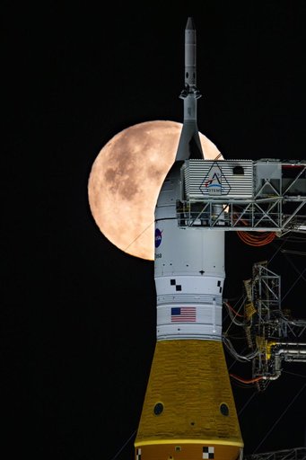 Full Moon Rising Over Full Artemis II Stack at Launch Pad 39B