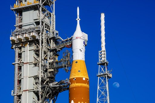 Moon Seen behind Full Artemis II Stack at Launch Pad 39B