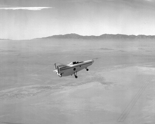 M2-F1 in flight over lakebed on tow line