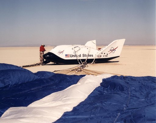 A Ground Crewman Checks Over the X-38 Second Prototype Following the Lakebed Landing of Its Fifth Flight at Edwards Air Force Base