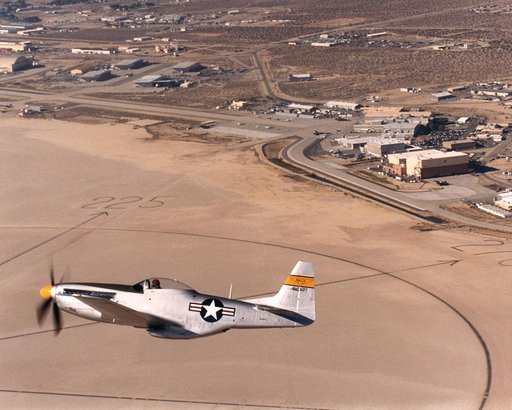 A restored NACA P-51D Mustang in flight