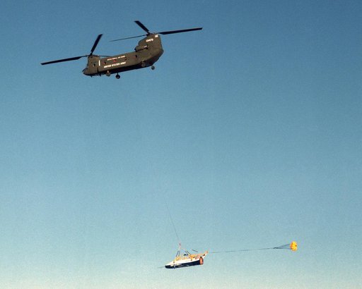 The X-40 sub-scale technology demonstrator is suspended under a U.S. Army CH-47 Chinook cargo helicopter during a captive-carry test flight at NASA's Dryden Flight Research Center, Edwards, California.
