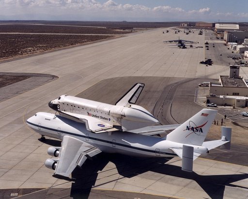 NASA's space shuttle Atlantis and its 747 carrier taxied on the Edwards Air Force Base flightline as the unusual combination left for Kennedy Space Center, Florida, on March 1, 2001