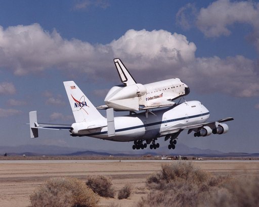 NASA's space shuttle Atlantis and its 747 carrier taxied on the Edwards Air Force Base flightline as the unusual combination left for Kennedy Space Center, Florida, on March 1, 2001