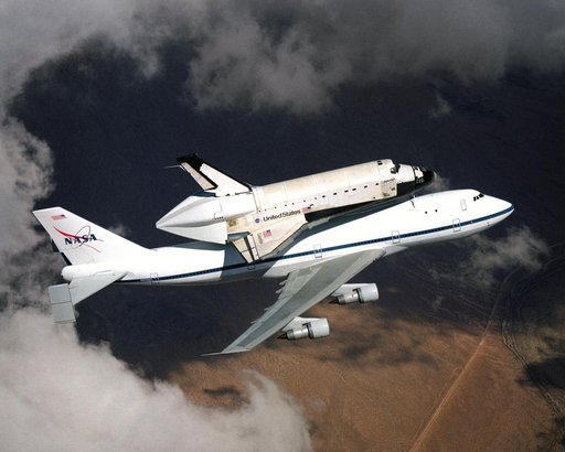 NASA space shuttle Columbia hitched a ride on a special 747 carrier aircraft for the flight from Palmdale, California, to Kennedy Space Center, Florida, on March 1, 2001