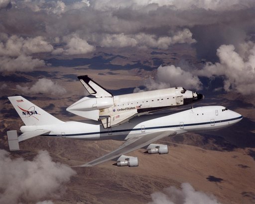 NASA space shuttle Columbia hitched a ride on a special 747 carrier aircraft for the flight from Palmdale, California, to Kennedy Space Center, Florida, on March 1, 2001