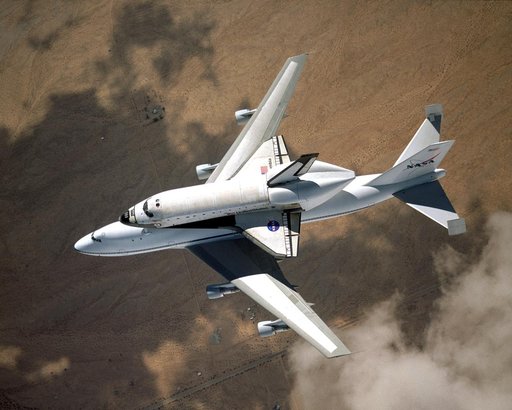 NASA space shuttle Columbia hitched a ride on a special 747 carrier aircraft for the flight from Palmdale, California, to Kennedy Space Center, Florida, on March 1, 2001